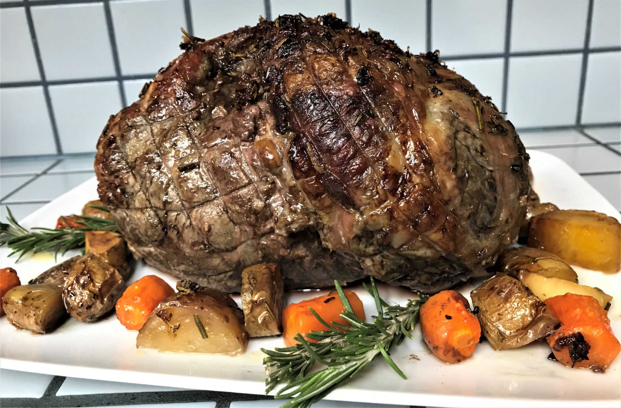 Roasted Leg of Lamb with Fingerling Potatoes, Carrots, and Parsnips and