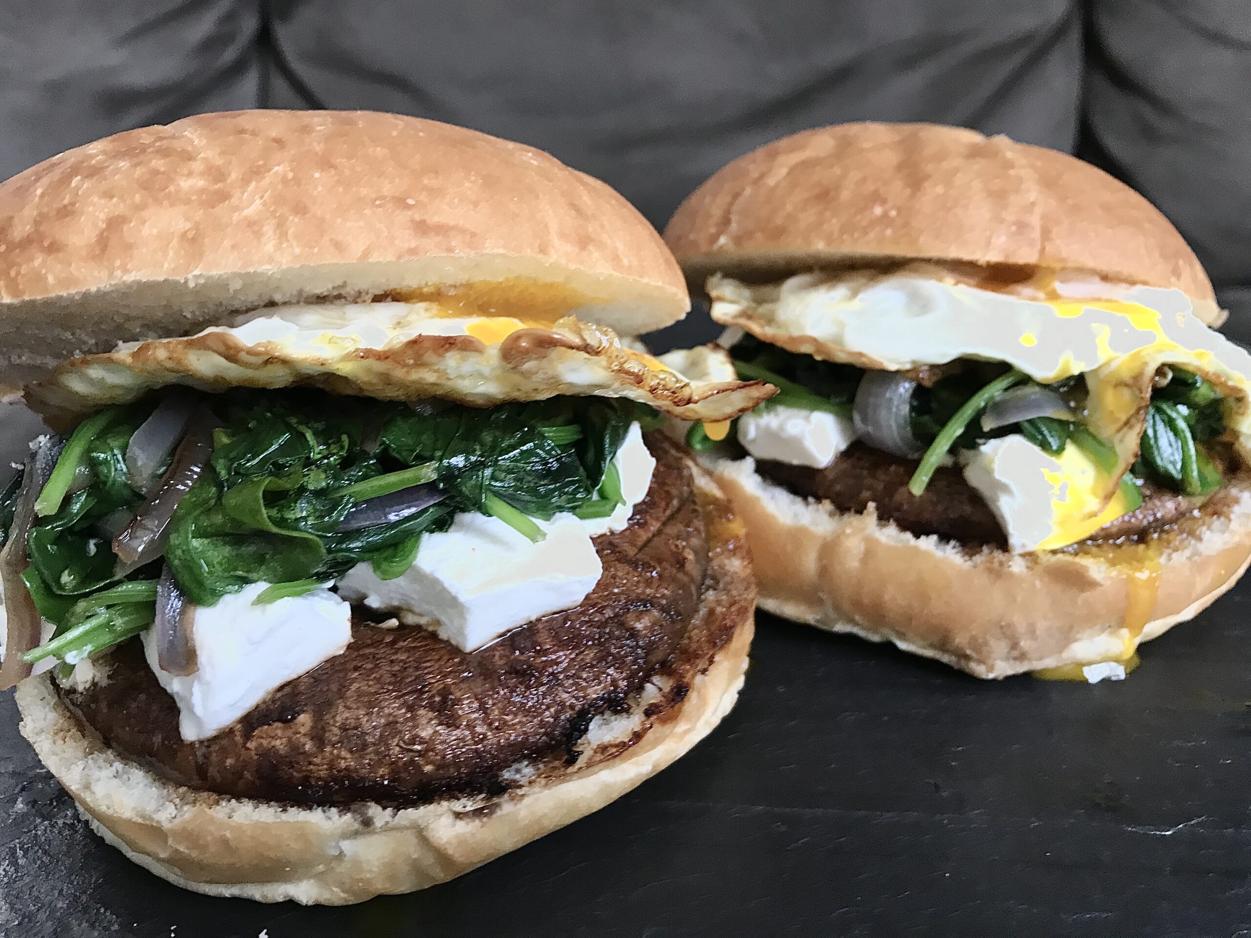 Marinated Portobello Mushroom Burger with Fried Egg, Goat Cheese, Spinach, & Caramelized Red Onion