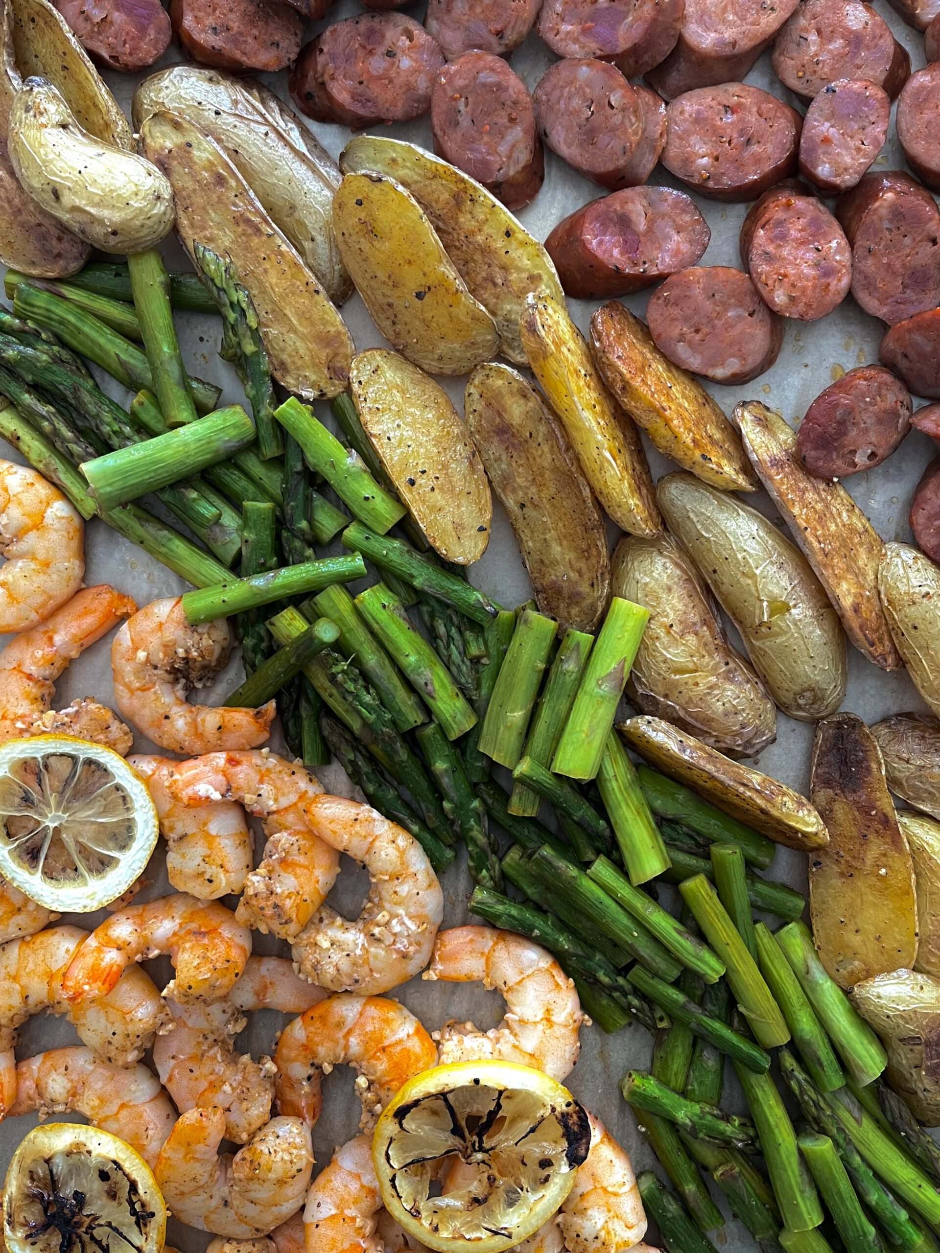 Sheet Pan Cajun Shrimp, Chicken Sausage, Asparagus, and Fingerling Potatoes  • Sarah Koszyk