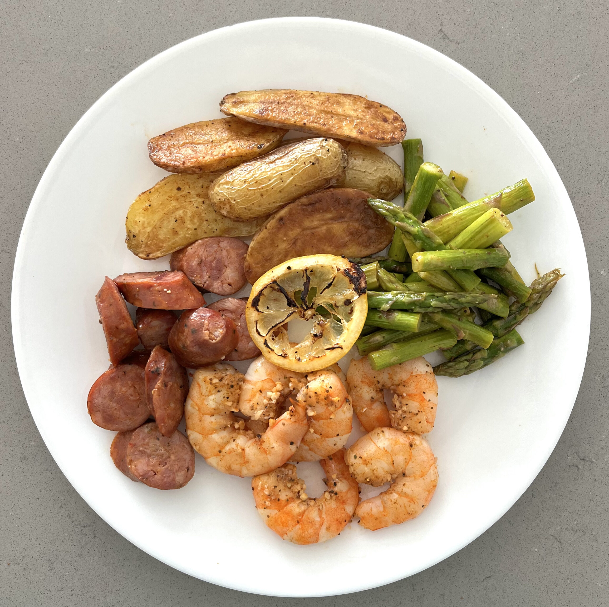 Sheet Pan Cajun Shrimp, Chicken Sausage, Asparagus, and Fingerling Potatoes  • Sarah Koszyk
